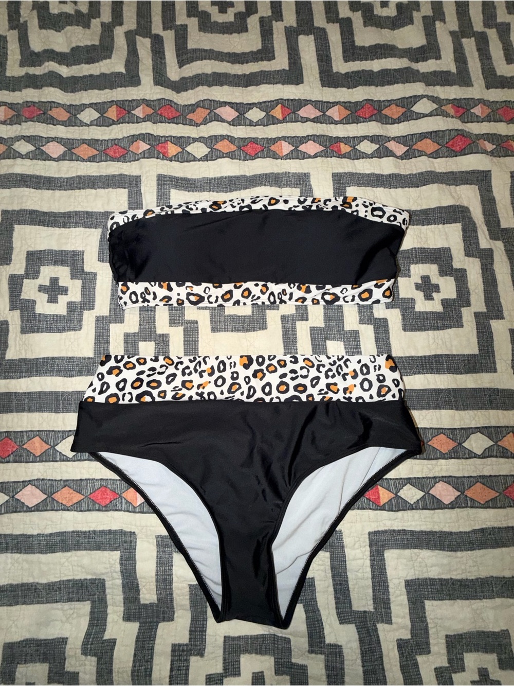 Woman’s Black Two-Piece Swim Set with Leopard Trim